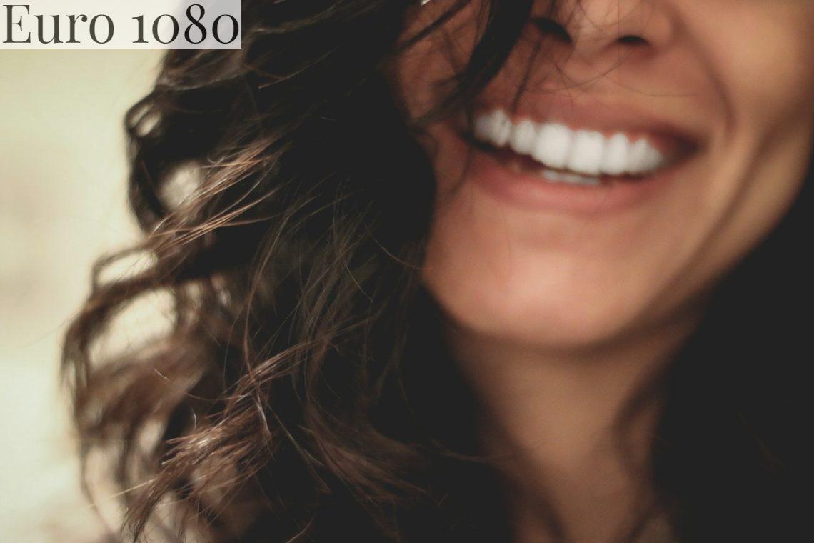 long black haired woman smiling close-up photography